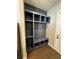 Mudroom features a built-in storage bench with hooks and shelves, providing practical organization at 1781 Lakehill Dr, Winter Haven, FL 33884