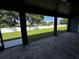 The covered patio features stone pavers and a view of the green backyard at 1781 Lakehill Dr, Winter Haven, FL 33884
