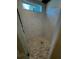 Elegant shower with marble-look tiles, pebble floor, and a window for natural light at 1781 Lakehill Dr, Winter Haven, FL 33884