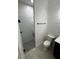 Modern bathroom with glass shower and shiplap accent wall at 1787 Lakehill Dr, Winter Haven, FL 33884
