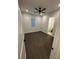 Bedroom with dark wood floors, fan, a window with blinds, and an ensuite bath at 1787 Lakehill Dr, Winter Haven, FL 33884