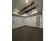Bright bedroom showcasing tray ceilings with wood beams and a modern ceiling fan at 1787 Lakehill Dr, Winter Haven, FL 33884