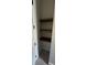 A small closet featuring three wooden shelves at 1787 Lakehill Dr, Winter Haven, FL 33884