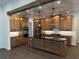 Large kitchen with stainless steel appliances and dark countertops at 1787 Lakehill Dr, Winter Haven, FL 33884