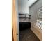 Walk-in pantry featuring hardwood floors and shelving units at 1787 Lakehill Dr, Winter Haven, FL 33884