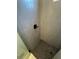 Modern shower featuring gray vertical tiling and a black hexagonal tiled floor at 1787 Lakehill Dr, Winter Haven, FL 33884