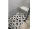 Close up of shower floor with patterned tiles, a corner bench, and a glass enclosure at 1787 Lakehill Dr, Winter Haven, FL 33884