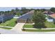 Aerial view of home featuring a two car garage and green landscaping at 186 Viola Dr, Auburndale, FL 33823