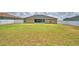 A spacious backyard featuring a well-maintained lawn and privacy fence at 186 Viola Dr, Auburndale, FL 33823