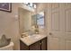 Bathroom with modern vanity, mirror, and neutral decor at 186 Viola Dr, Auburndale, FL 33823