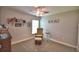 Bedroom with seating area, carpet flooring, and decorations on the walls at 186 Viola Dr, Auburndale, FL 33823
