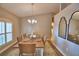 Dining space with wood table, chandelier, and ample natural light at 186 Viola Dr, Auburndale, FL 33823