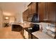 Kitchen with granite countertops, stainless steel appliances, and an adjacent breakfast nook at 186 Viola Dr, Auburndale, FL 33823