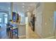 Kitchen with a breakfast bar with seating, tile floors, and stainless steel appliances at 186 Viola Dr, Auburndale, FL 33823