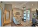 Bright living room with comfortable seating, vaulted ceiling, and view to the entry at 186 Viola Dr, Auburndale, FL 33823