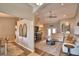 Open-concept living room with high ceilings, neutral colors, and seamless flow to dining area at 186 Viola Dr, Auburndale, FL 33823