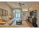 Living room with comfortable sofa, vaulted ceiling, ceiling fan, TV and modern decor at 186 Viola Dr, Auburndale, FL 33823