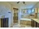 Spacious main bathroom with a soaking tub and glass-enclosed shower at 186 Viola Dr, Auburndale, FL 33823