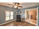 Cozy office space with fan, reading chair, and natural light at 186 Viola Dr, Auburndale, FL 33823
