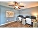 Spacious office space with fan, desk setup, and wood-look flooring at 186 Viola Dr, Auburndale, FL 33823