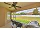 Screened-in patio offering views of a large, fenced backyard at 186 Viola Dr, Auburndale, FL 33823