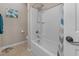 Bathroom with white tub shower with blue-grey shower curtain at 225 Summershore Dr, Auburndale, FL 33823