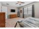 Spacious bedroom with a ceiling fan, carpeted floors and a view of the dresser at 225 Summershore Dr, Auburndale, FL 33823