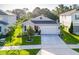 Aerial view of a well-maintained gray single-story house with a 2-car garage at 225 Summershore Dr, Auburndale, FL 33823