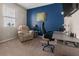 Comfortable home office featuring modern furniture, carpeted floors, and a bright blue accent wall at 225 Summershore Dr, Auburndale, FL 33823