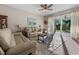 Inviting living room with sliding glass doors leading to outdoor space and filled with natural light at 225 Summershore Dr, Auburndale, FL 33823