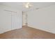 Bedroom with ceiling fan, closet and neutral carpet; features a light, airy ambiance at 230 Cove At Eagle Lake Cir, Eagle Lake, FL 33839