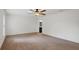 Cozy bedroom with neutral carpeting and a ceiling fan at 230 Cove At Eagle Lake Cir, Eagle Lake, FL 33839
