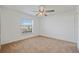 Bright bedroom with large window and neutral carpeting, offering a cozy and inviting space at 230 Cove At Eagle Lake Cir, Eagle Lake, FL 33839