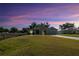 Charming one-story home with a well-manicured lawn and a two-car garage at 230 Cove At Eagle Lake Cir, Eagle Lake, FL 33839