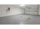 Spacious two-car garage with an automatic door at 230 Cove At Eagle Lake Cir, Eagle Lake, FL 33839