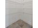 Walk-in pantry features wire shelving and tile flooring at 230 Cove At Eagle Lake Cir, Eagle Lake, FL 33839