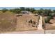 Aerial view of the house located on a large lot with a long driveway through the land at 2390 Lake Easy Rd, Babson Park, FL 33827