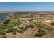 Wide aerial view of property with multiple small lakes nearby and light vegetation and clear blue skies at 2390 Lake Easy Rd, Babson Park, FL 33827