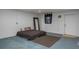 Finished basement features a bed on the floor, carpet, painted floor, and access to the exterior at 2390 Lake Easy Rd, Babson Park, FL 33827