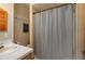 This bathroom features a combination shower and tub and a single sink vanity at 2390 Lake Easy Rd, Babson Park, FL 33827