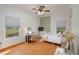 Inviting bedroom featuring a desk, comfortable furniture and two windows that provides natural light at 2390 Lake Easy Rd, Babson Park, FL 33827