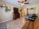Bonus room featuring unique shelving, a ceiling fan, and neutral walls at 2390 Lake Easy Rd, Babson Park, FL 33827
