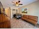 Bonus room featuring unique shelving, a ceiling fan, and neutral walls at 2390 Lake Easy Rd, Babson Park, FL 33827