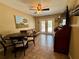 Inviting dining area featuring a round table and chairs, offering a comfortable and stylish space at 2390 Lake Easy Rd, Babson Park, FL 33827