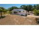 Charming single-Gathering home on a large lot with mature trees and a spacious front yard at 2390 Lake Easy Rd, Babson Park, FL 33827