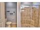 Modern bathroom featuring a glass door shower and tiled walls at 2577 Canyon Crest Dr, Lakeland, FL 33811