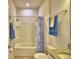 Bright bathroom offering a full tub with shower, tile surround, and granite vanity for a clean design at 2577 Canyon Crest Dr, Lakeland, FL 33811