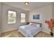 Cozy bedroom with natural light, carpeted floors, and simple decor at 2577 Canyon Crest Dr, Lakeland, FL 33811