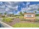 Welcoming entrance to Heritage Landings, featuring lush landscaping and a secure gated entry at 2577 Canyon Crest Dr, Lakeland, FL 33811