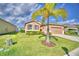 Charming single-story home with well-manicured lawn, lovely landscaping, and an attached two-car garage at 2577 Canyon Crest Dr, Lakeland, FL 33811
